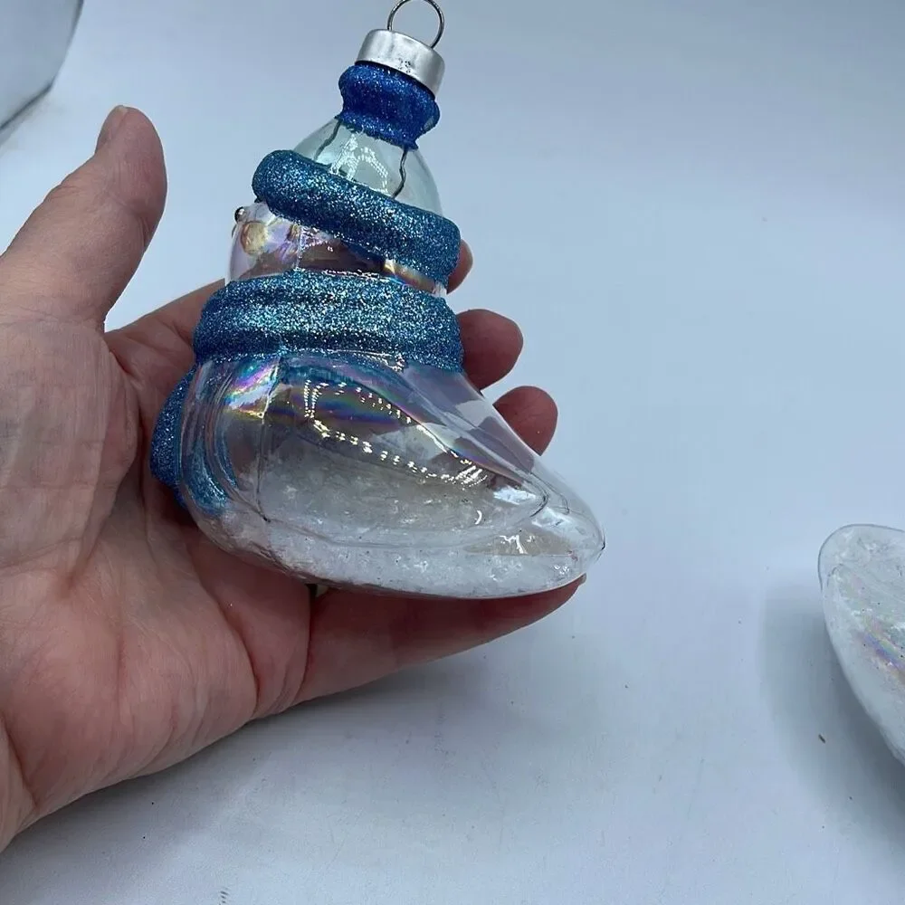 Lot of 2 glass chickadee ornaments with scarves and hats. Faux snow in bottoms.